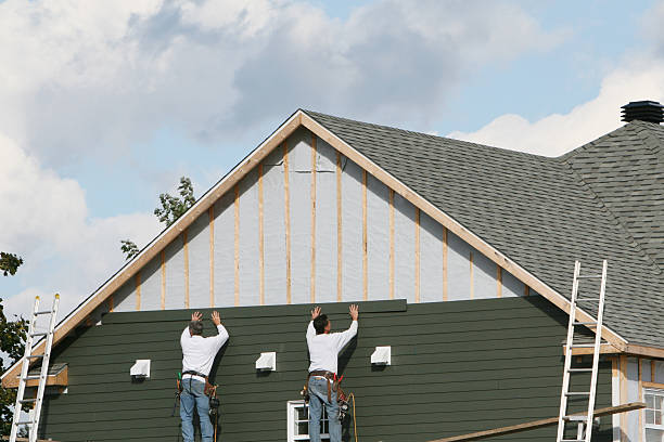 Professional Emergency Siding Repair technician working in Urbana, IL